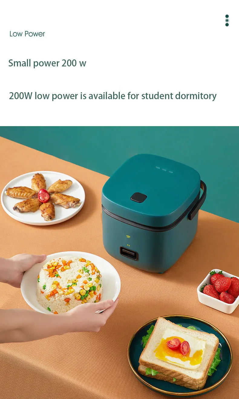 Teal mini electric rice cooker on kitchen table with servings and small dessert plate