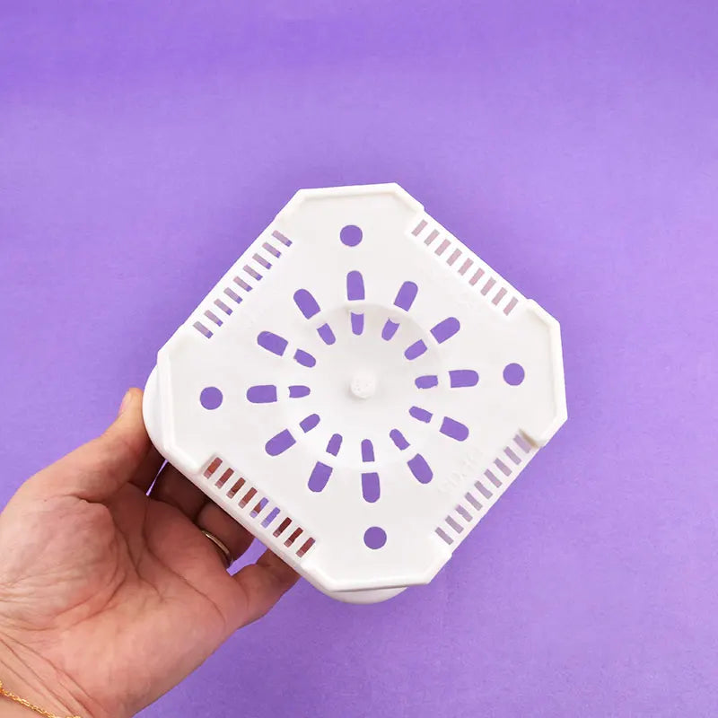 White square flower pot base with circular drainage hole pattern