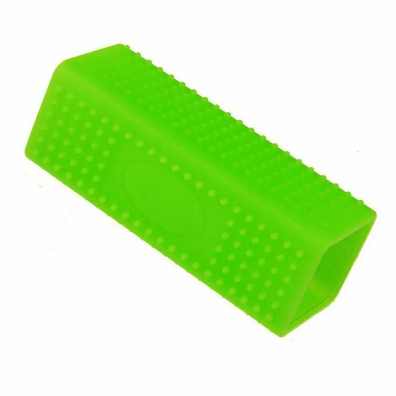 Green silicone pet hair removal brush for effective dog and cat fur cleaning from furniture and fabrics.