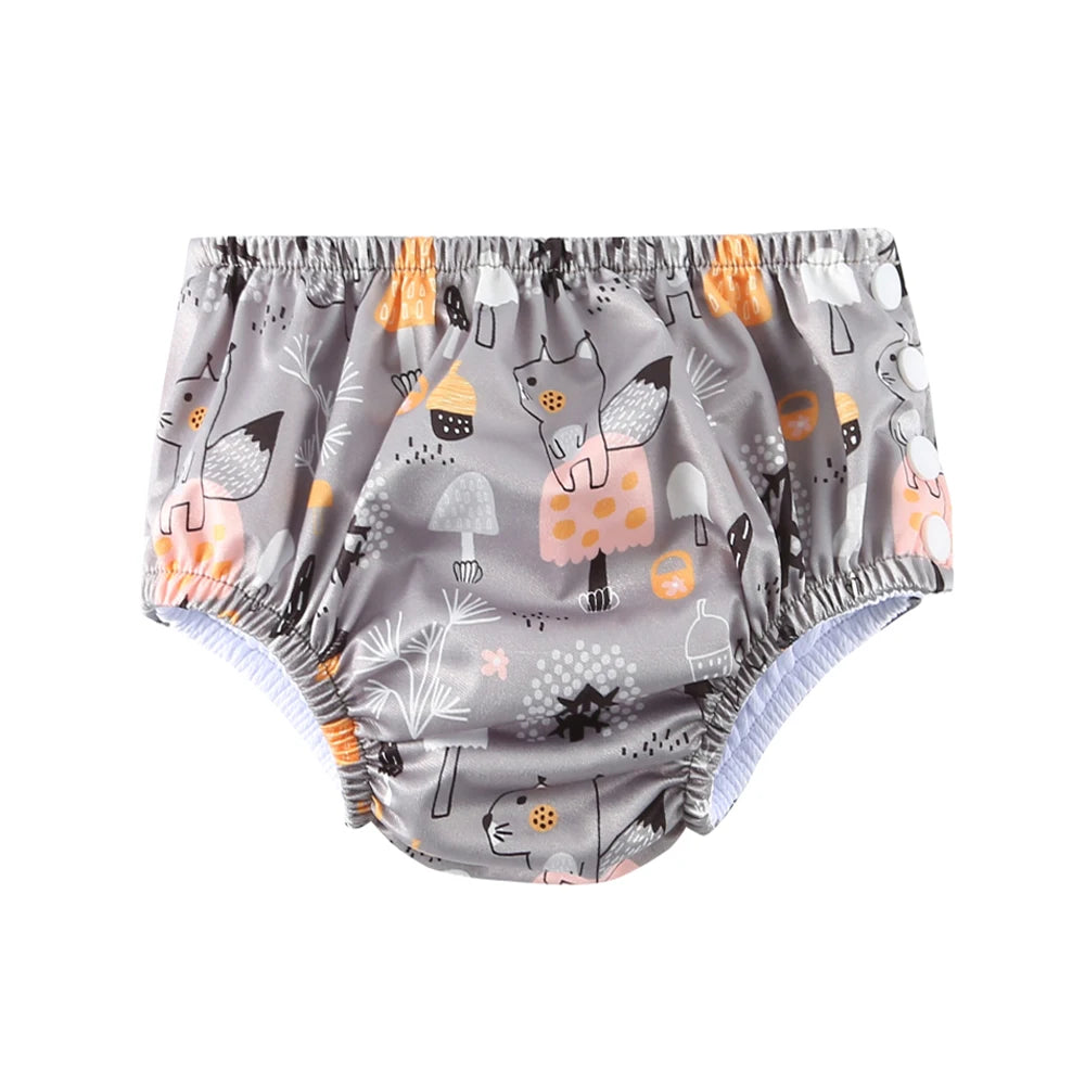 Reusable baby swim diaper in grey with cute fox and mushroom print. Elastic waist and leg openings for leak protection.