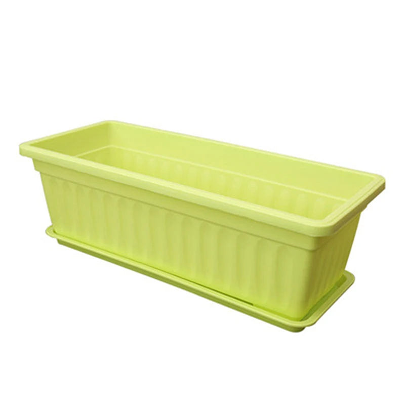 Rectangular plastic planter box with drainage slots, light green pot for balcony or indoor plants