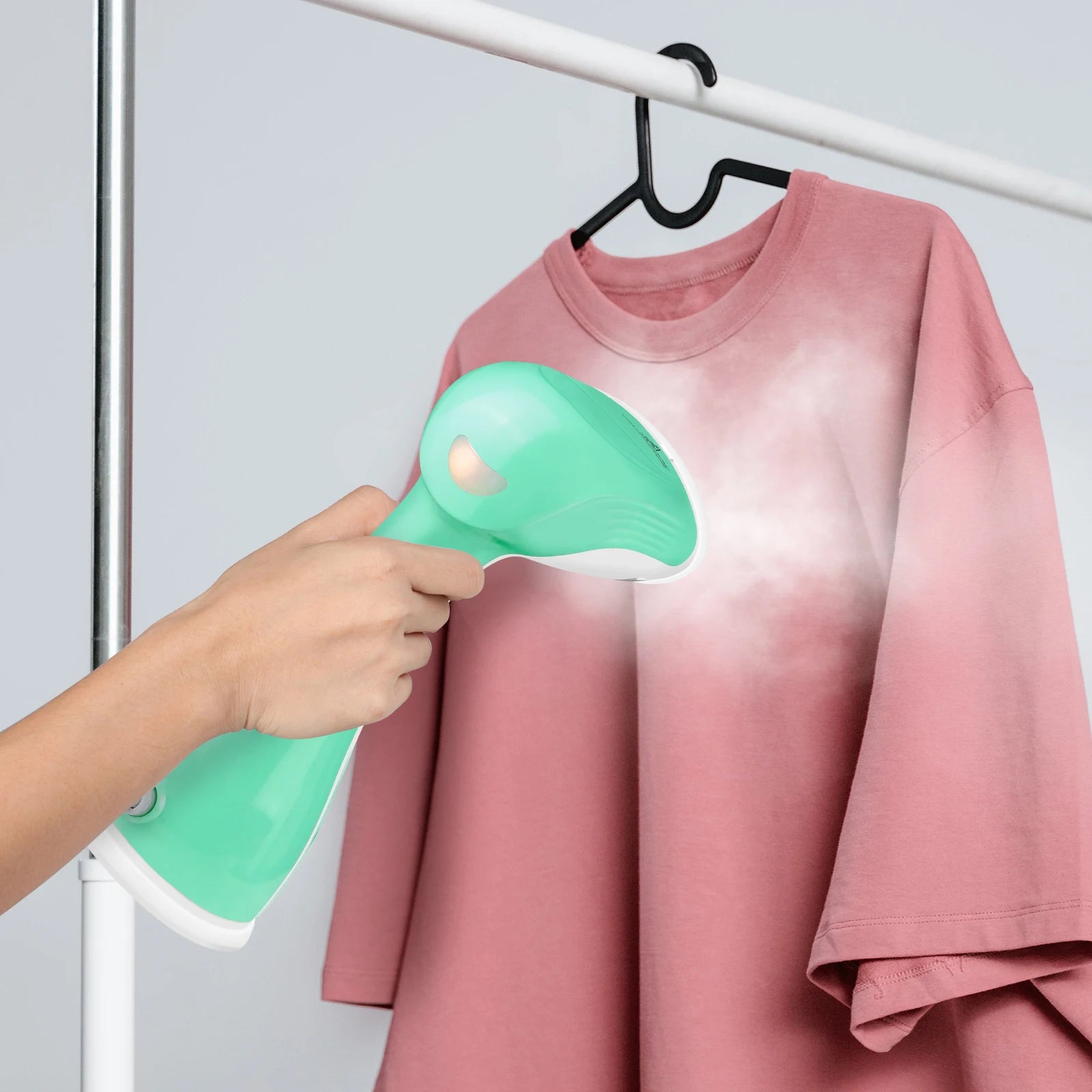 Tidesmit BRIEFNESS handheld garment steamer showing steam penetration feature for removing wrinkles on travel clothes