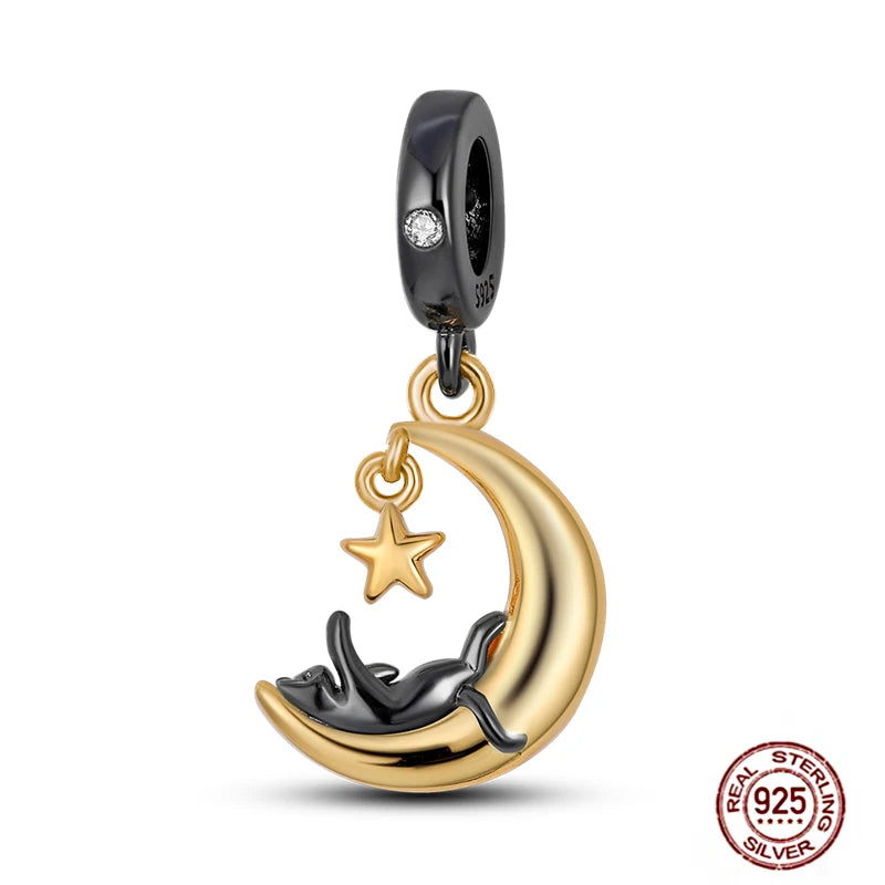 925 sterling silver cat charm pendant featuring a black cat sleeping on a gold moon and star for DIY charm bracelets.