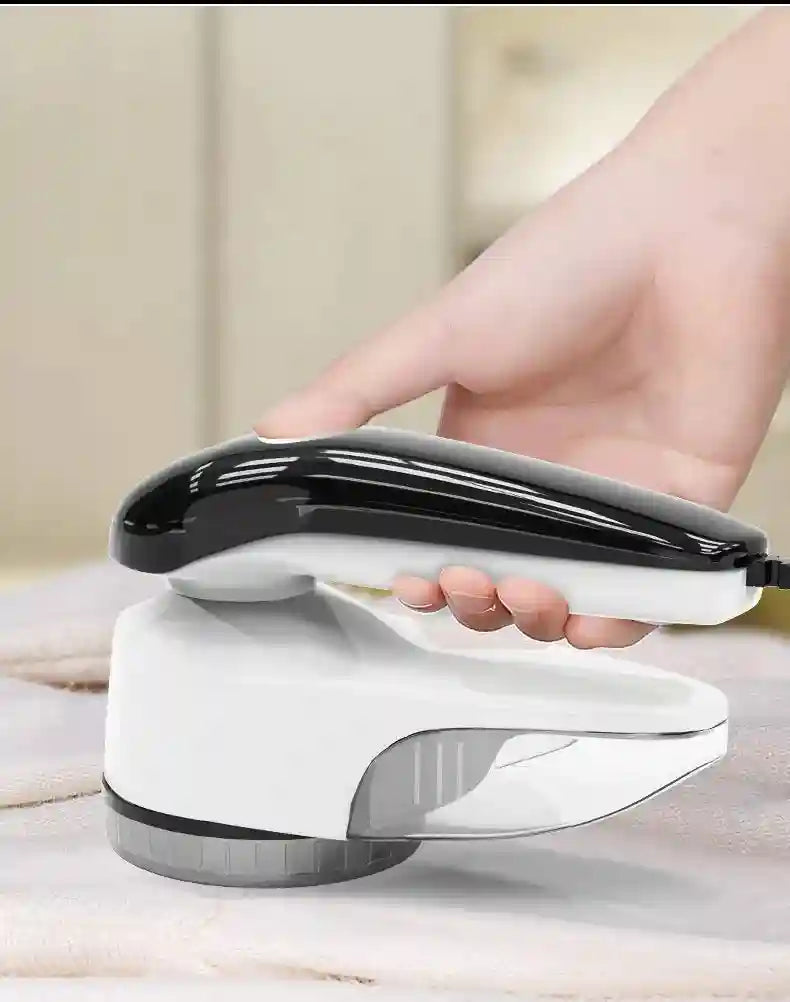Tidesmit portable electric lint remover showing ergonomic handle and blade shield for fabrics, carpets, and sweaters