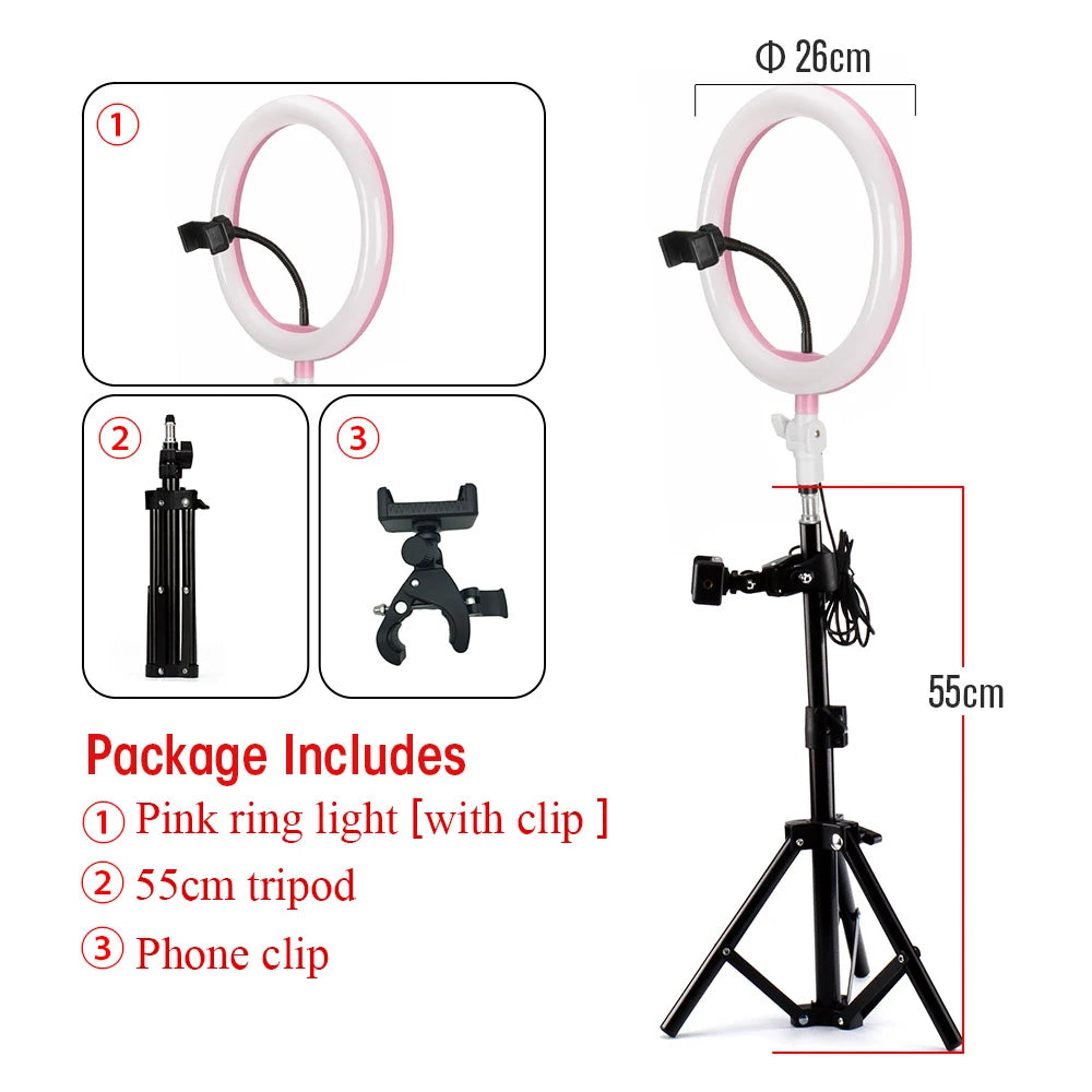 26cm pink LED ring light with phone mount, 55cm black tripod stand, and accessory clip for photography and streaming.