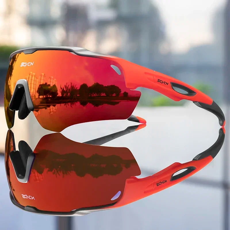 Cycling sunglasses with red reflective lens and white frame, black side grips