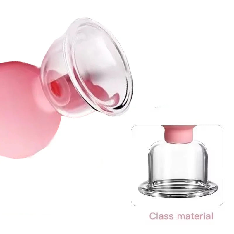 Facial cupping tool with a clear glass suction cup and a soft pink rubber squeeze bulb on a white background.