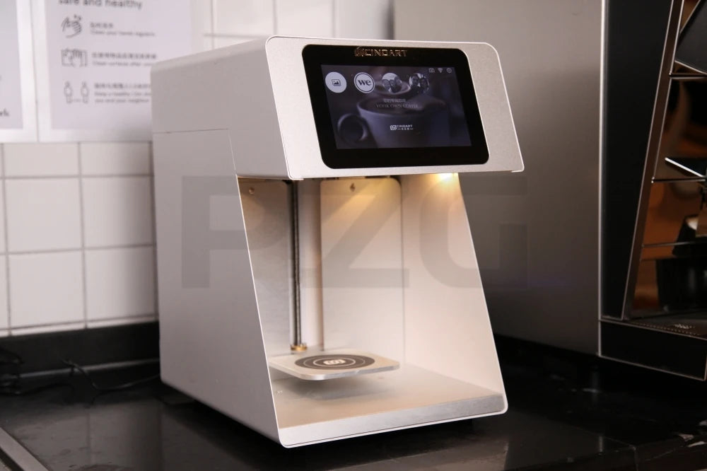 Cindart white digital coffee art printer with touchscreen display for customizing foam designs on coffee beverages.