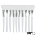 A set of 10 white silicone facial mask brushes with silver ferrules and white handles arranged in a row.