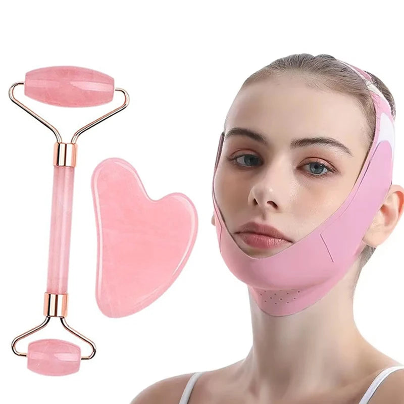 A pink V-shaped facial sculpting mask, a pink jade roller, and a heart-shaped gua sha tool on a white background.