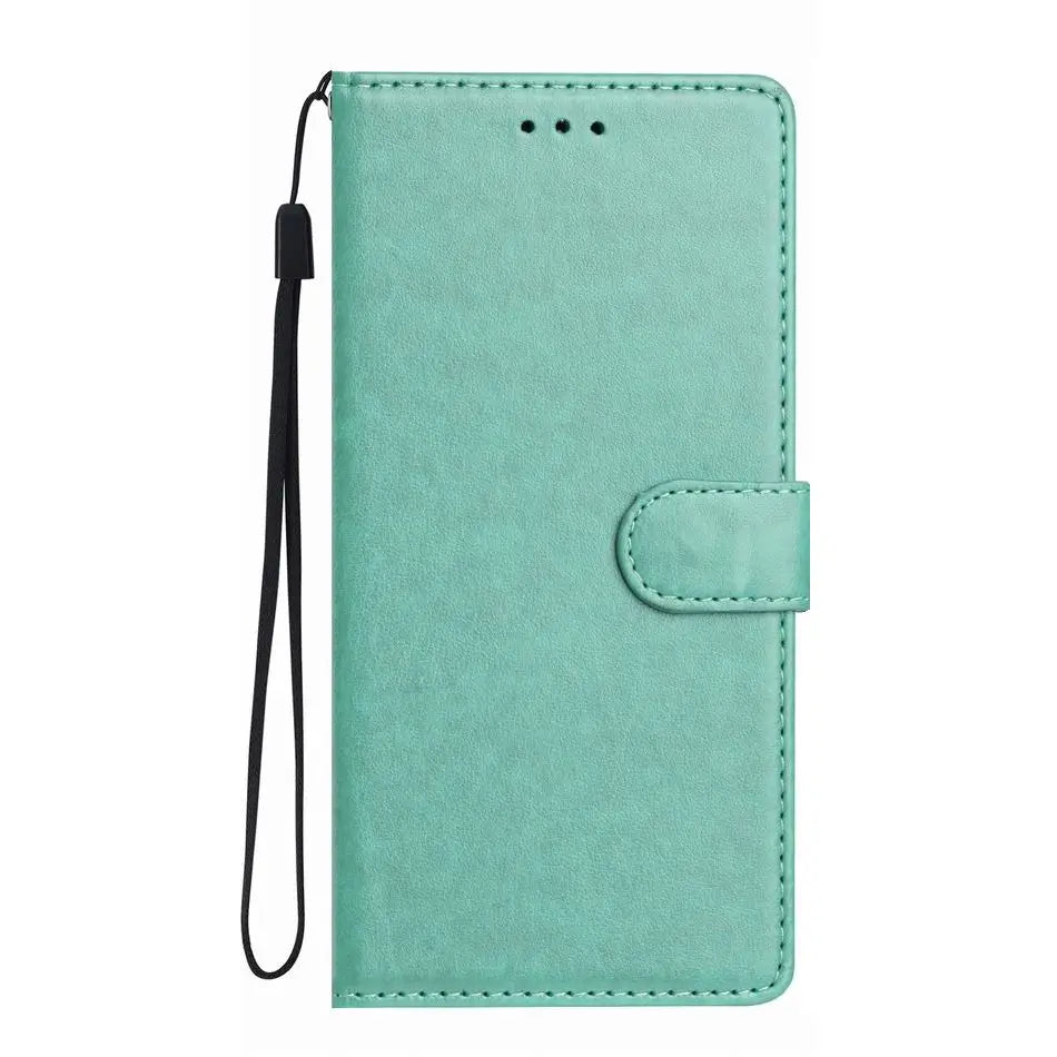 Mint green rectangular flip-style phone wallet case with a magnetic closure and a detachable black wrist strap.