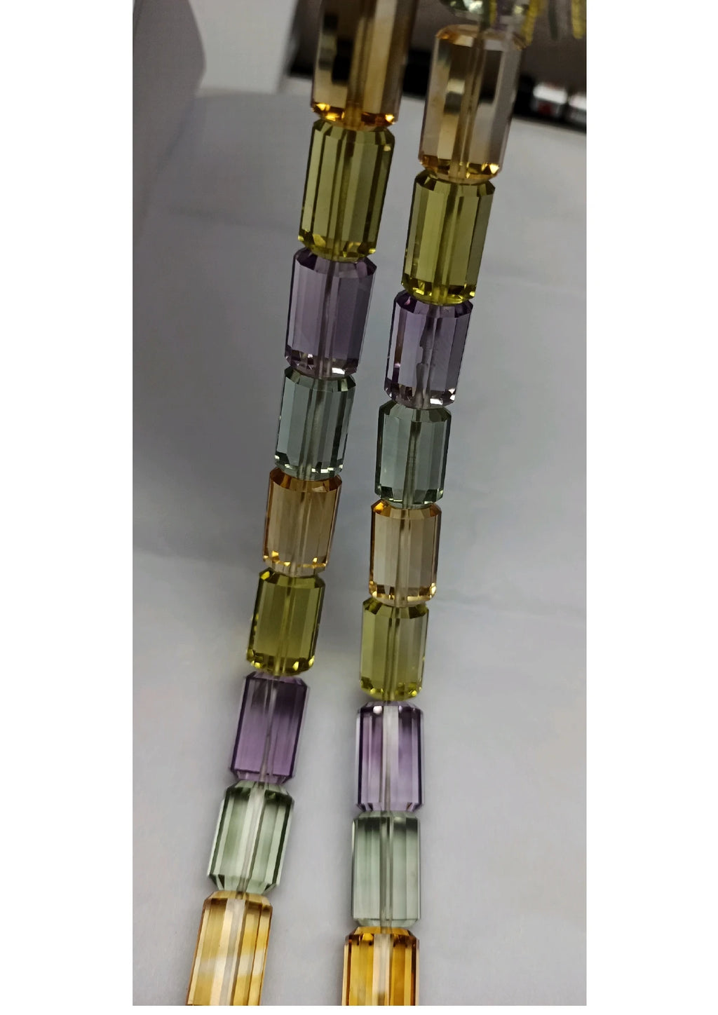 Faceted cylinder beads strand in green, gold, and lavender tones, 16-inch length