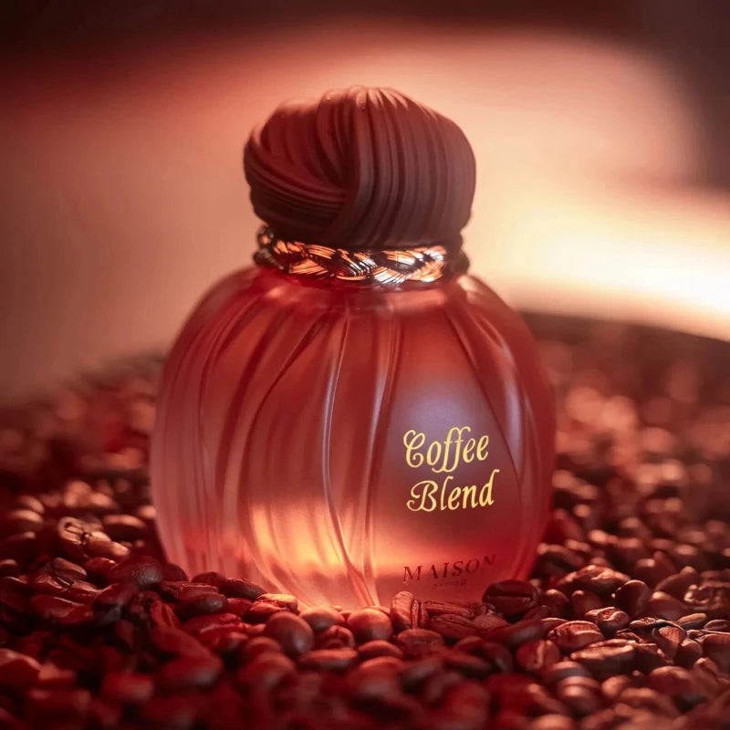 Maison Coffee Blend unisex EDP: 100ml oriental vanilla perfume with almond, caramel, musk in round, textured bottle.