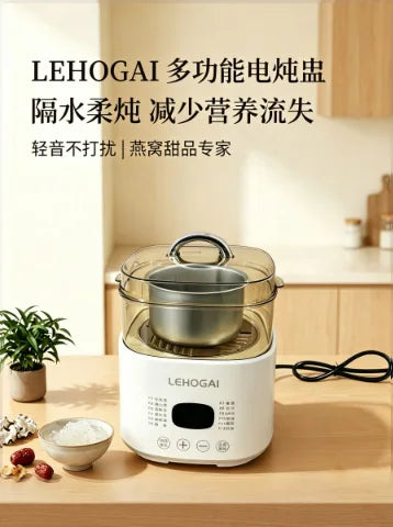 Electric multi-functional electric steamer with glass lid and stainless inner pot on counter
