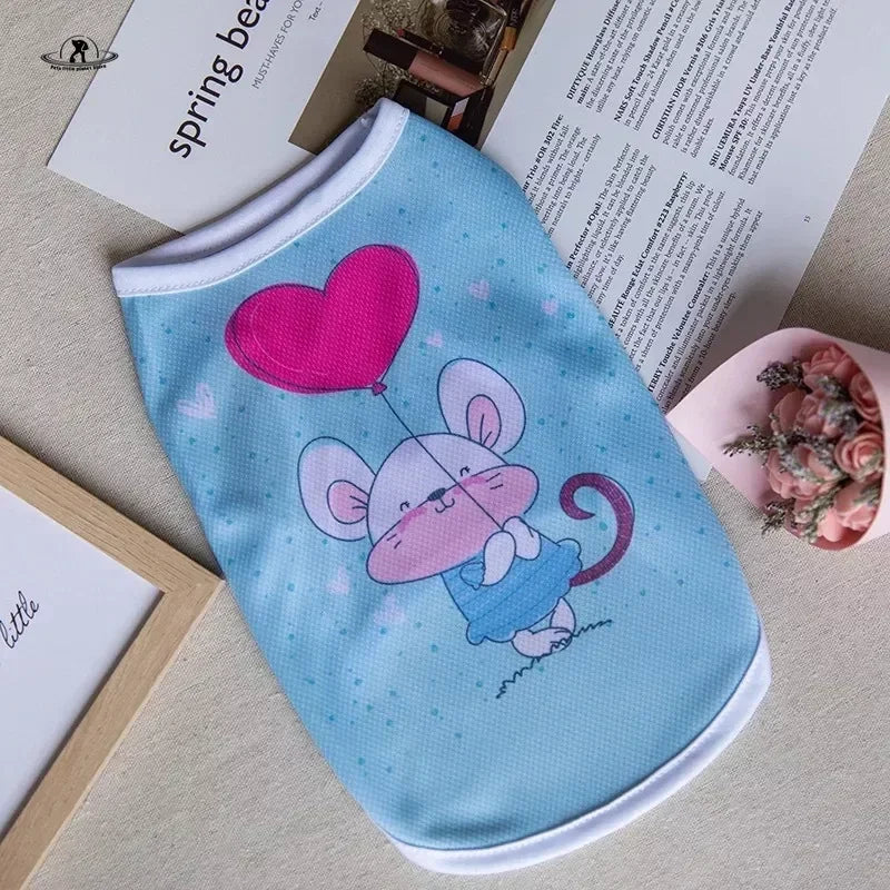 Blue cartoon mouse print summer dog vest for small pets. Lightweight, breathable puppy shirt for cute summer style.