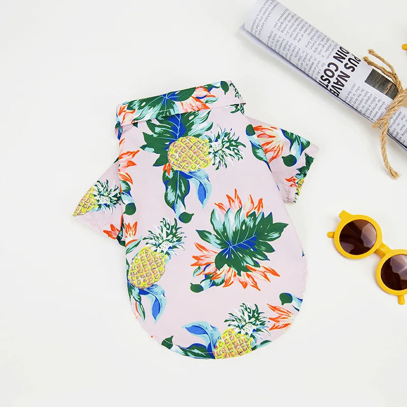 Breathable pink Hawaiian pineapple print dog shirt for summer. Comfortable, stylish pet clothing for small to large dogs.
