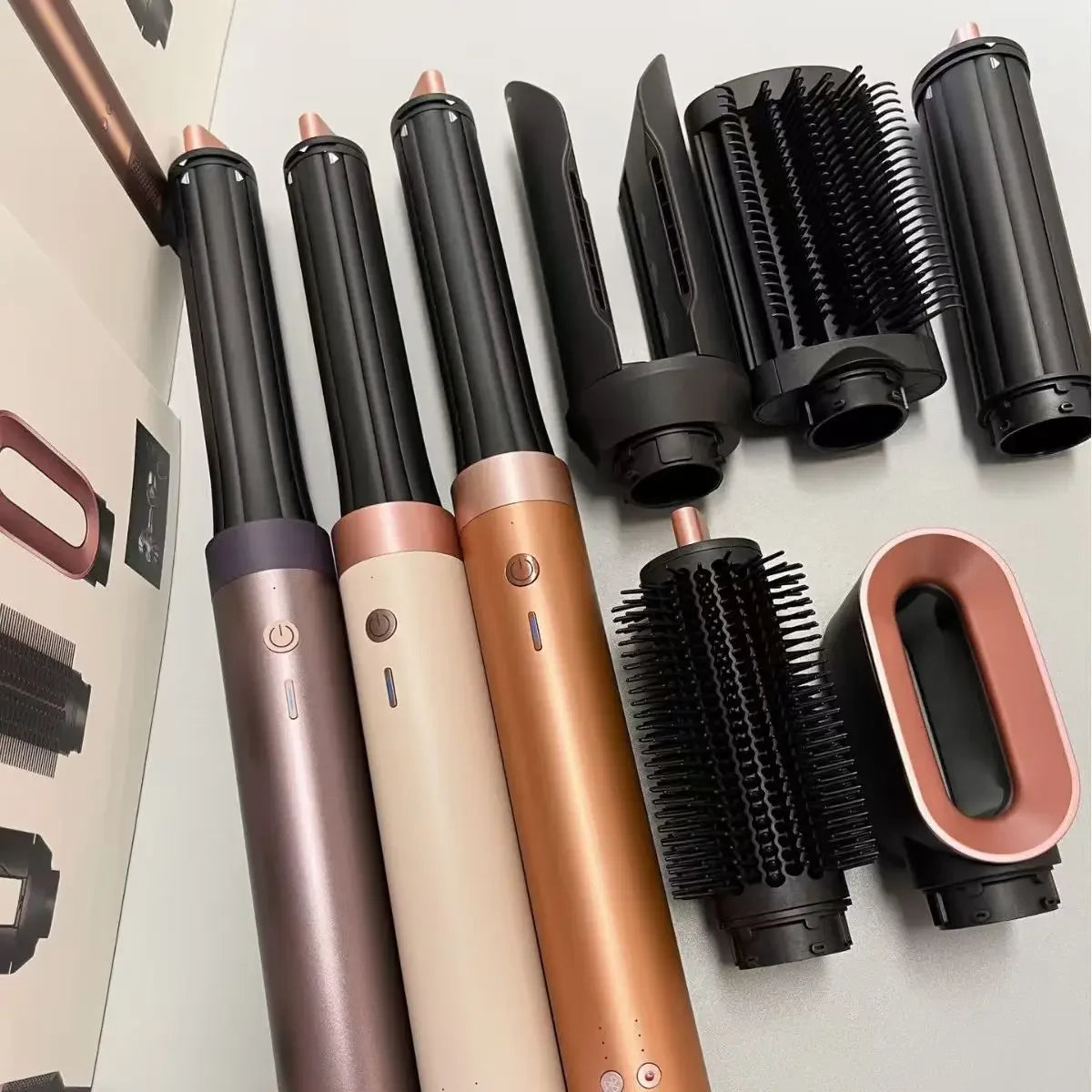 6-in-1 negative ion hair styler set with rose gold curling wands, blow dryer attachment, and brushes for styling.