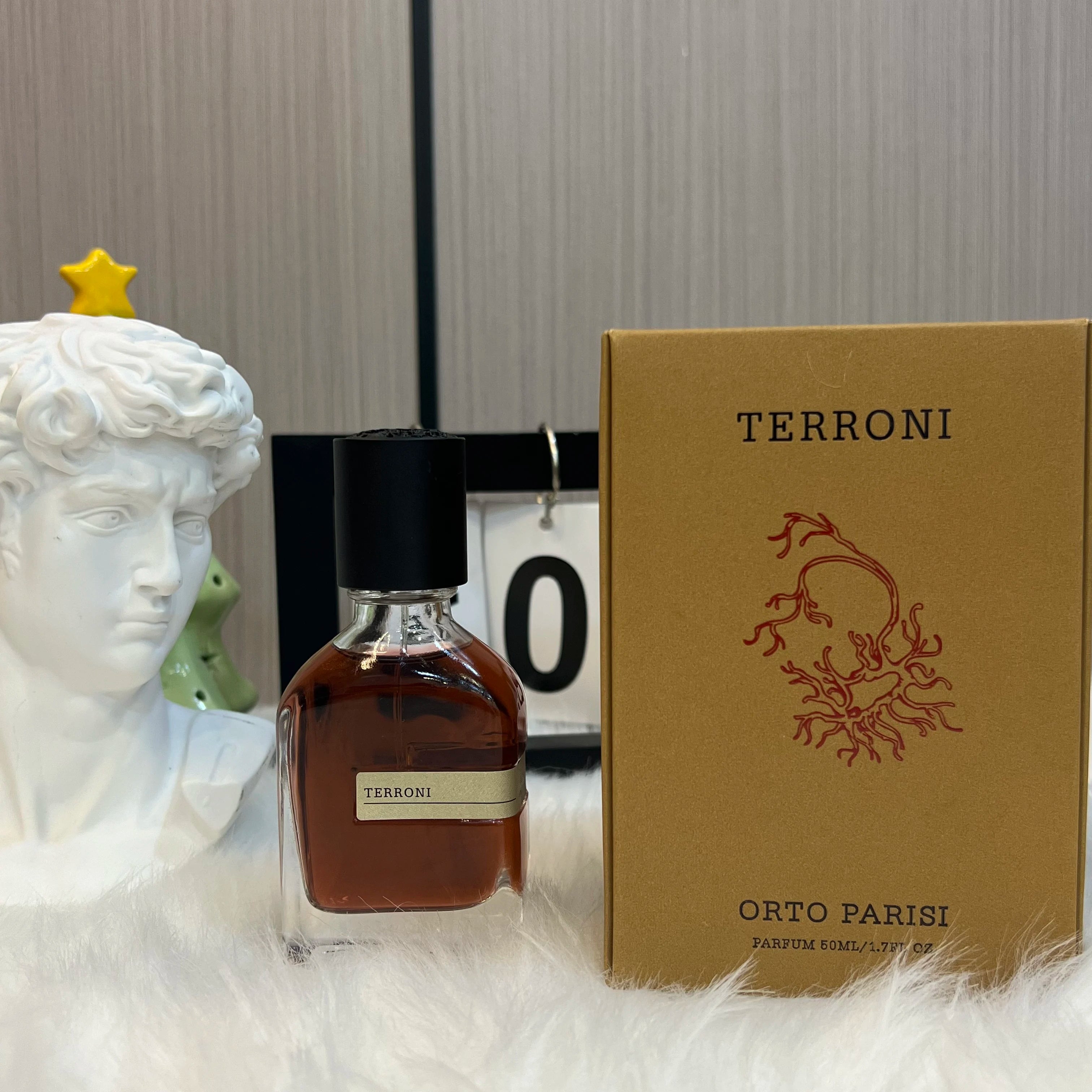 Orto Parisi Terroni unisex perfume, 50ml EDP. Woody, amber, earthy scent in a sleek glass bottle with black cap.