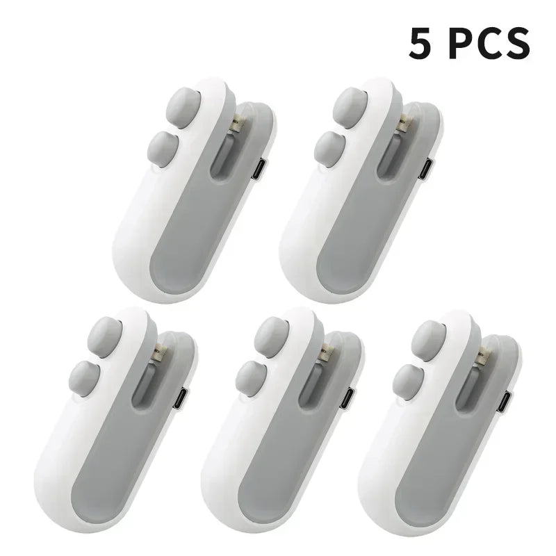 Set of five white portable handheld bag sealers with button and charging port