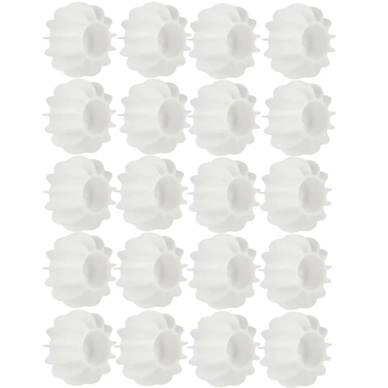 Reusable white silicone laundry balls for removing pet hair and lint in the washing machine.