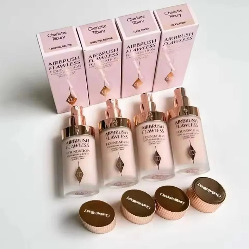Charlotte Tilbury Airbrush Flawless Foundation bottles and boxes in various nude, skin-perfecting shades.