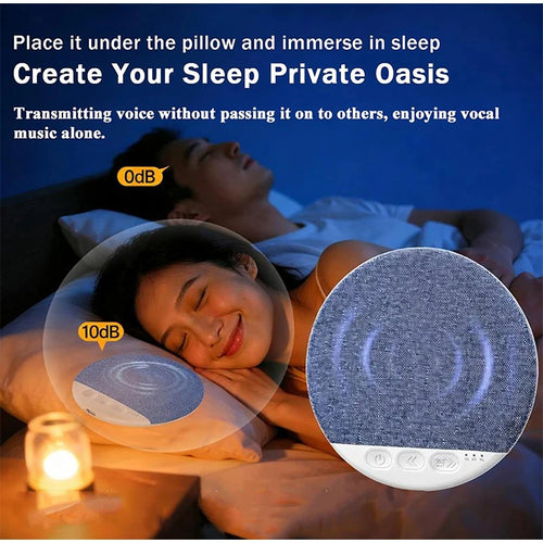 Blue, round sleep aid sound machine with control buttons placed under a pillow for better sleep.