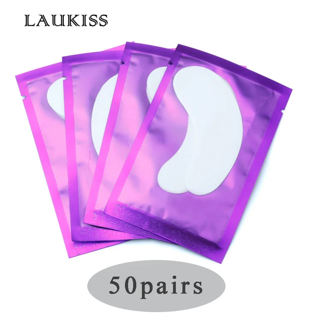 White gel eyelash extension under eye patches in purple metallic foil sachets for professional lash application.