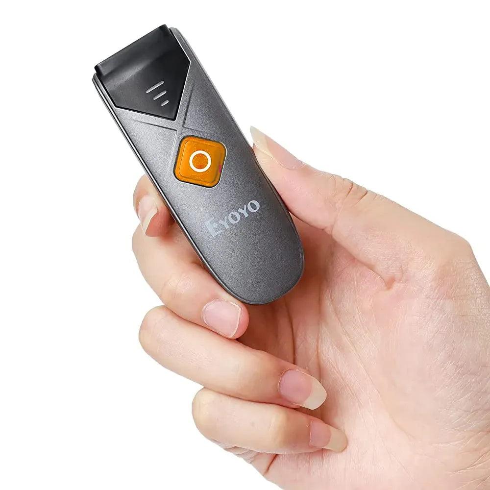 Orange-accent handheld barcode scanner with scan button, held in a person’s hand
