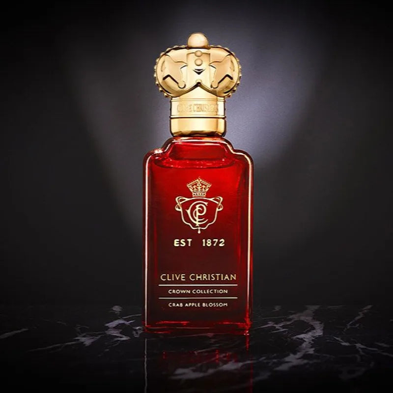 Clive Christian Crab Apple Blossom 50ml: Elegant red glass perfume bottle with gold crown cap. Floral amber scent.