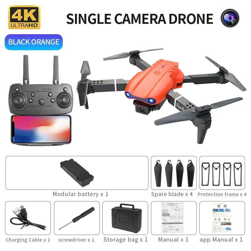 Black and orange 4K camera drone with remote controller, battery, spare blades, guards, and accessories in a case.