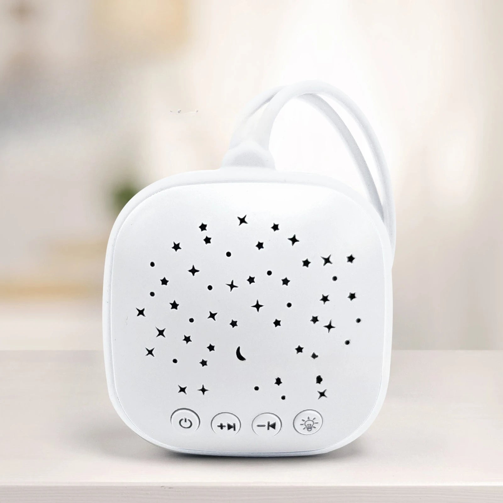 White portable sleep aid sound machine with star cutout, control buttons, and night light function for better sleep.