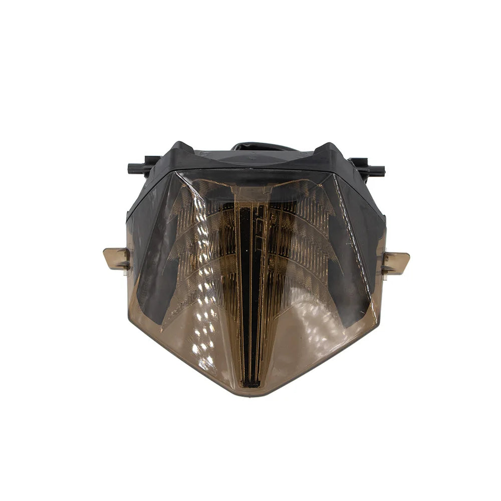 Motorcycle integrated LED taillight with amber-tinted lens and black mounting frame