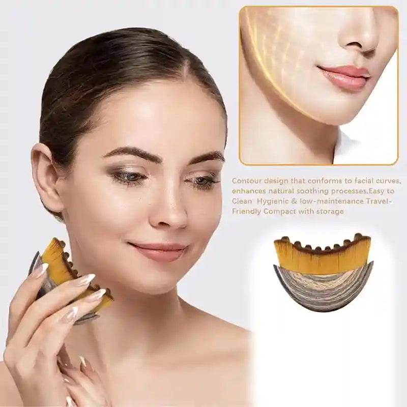 Woman holding a curved lymphatic contour face brush with soft, gold-tipped bristles and a wood-grain handle.