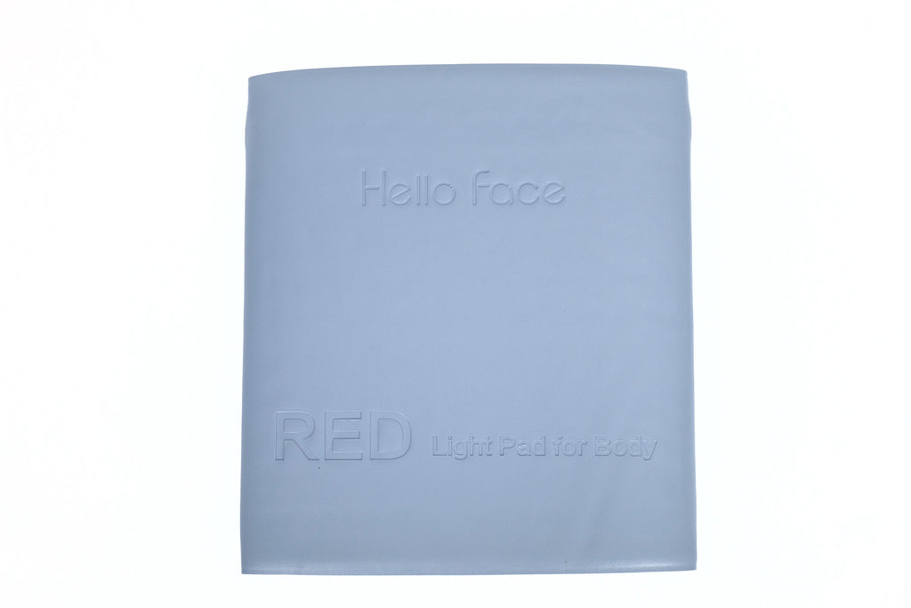 Hello Face light grey rectangular therapy mat with embossed brand name and text, isolated on white background.