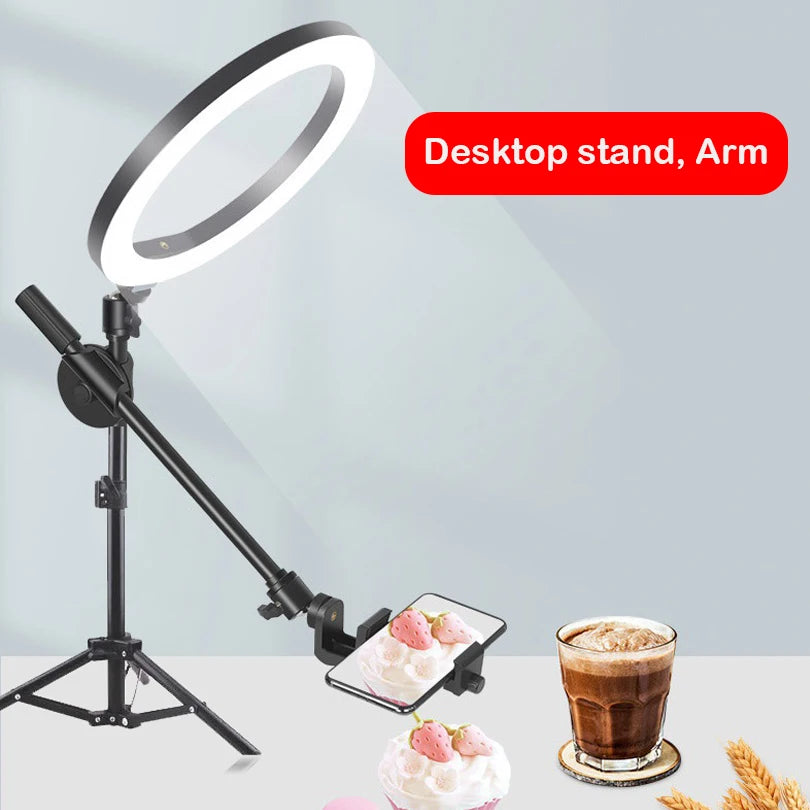 Black desktop ring light stand with an adjustable arm and phone holder for overhead photography and video recording.