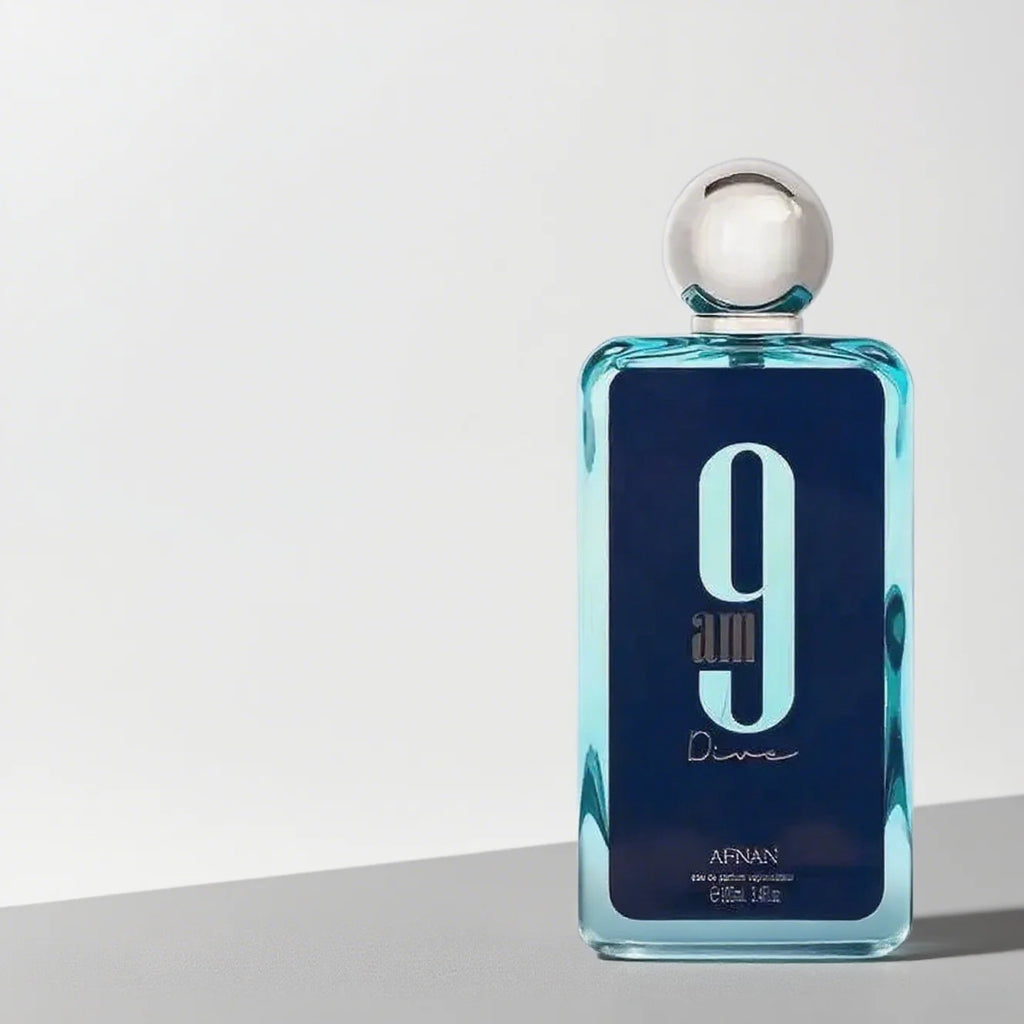 Afnan 9am Dive EDP for men: blue rectangular bottle, silver cap, long-lasting crisp ocean fragrance.