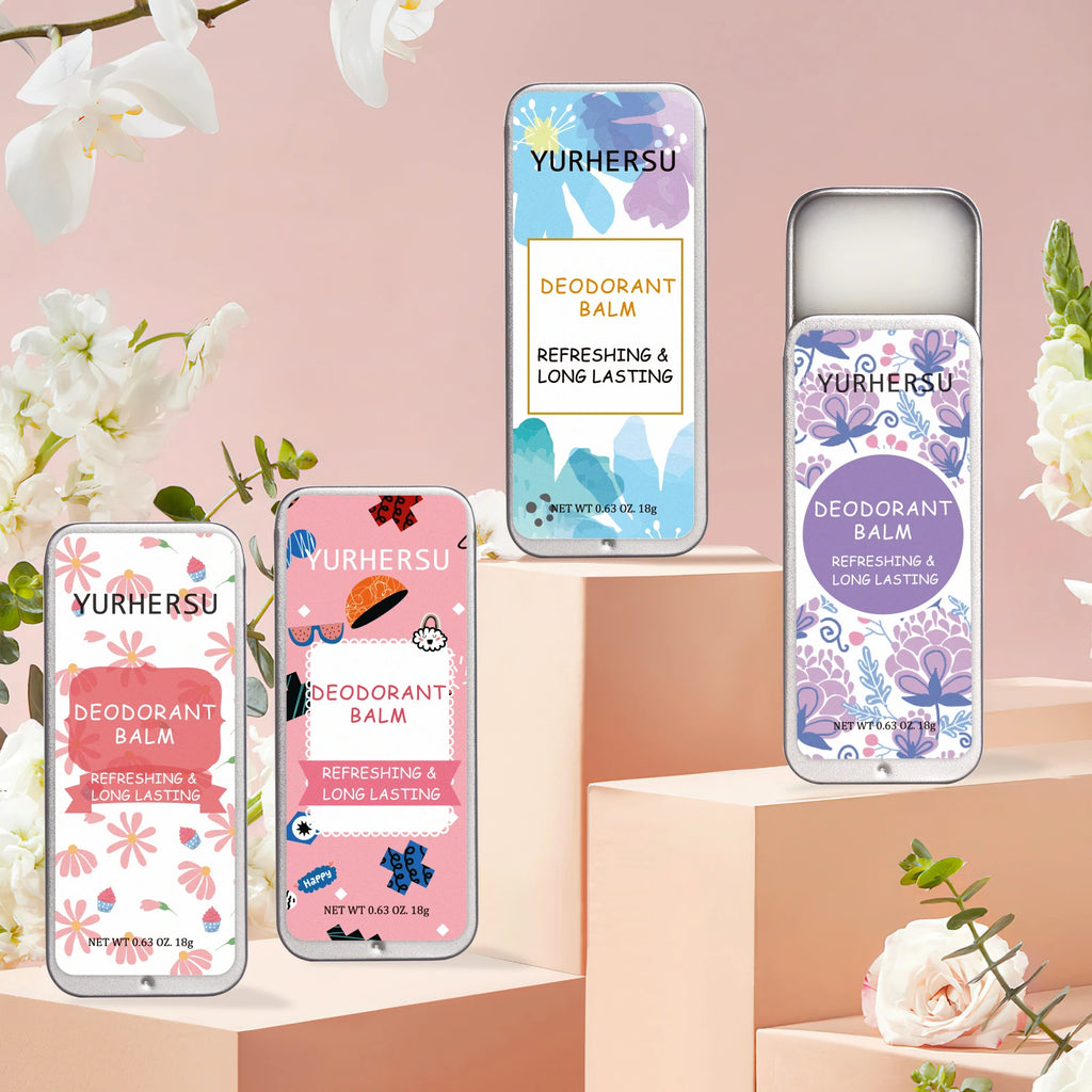 Four Yurhersu deodorizing balm tins with floral and colorful designs on display stands. Moisturizing lip balm texture.