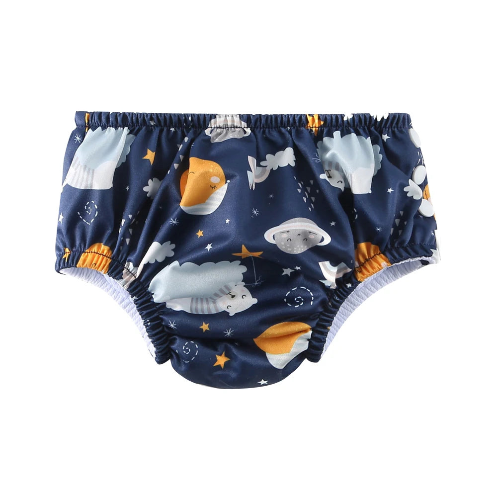 Reusable baby swim diaper in dark blue featuring a cute space, moon, and star print.