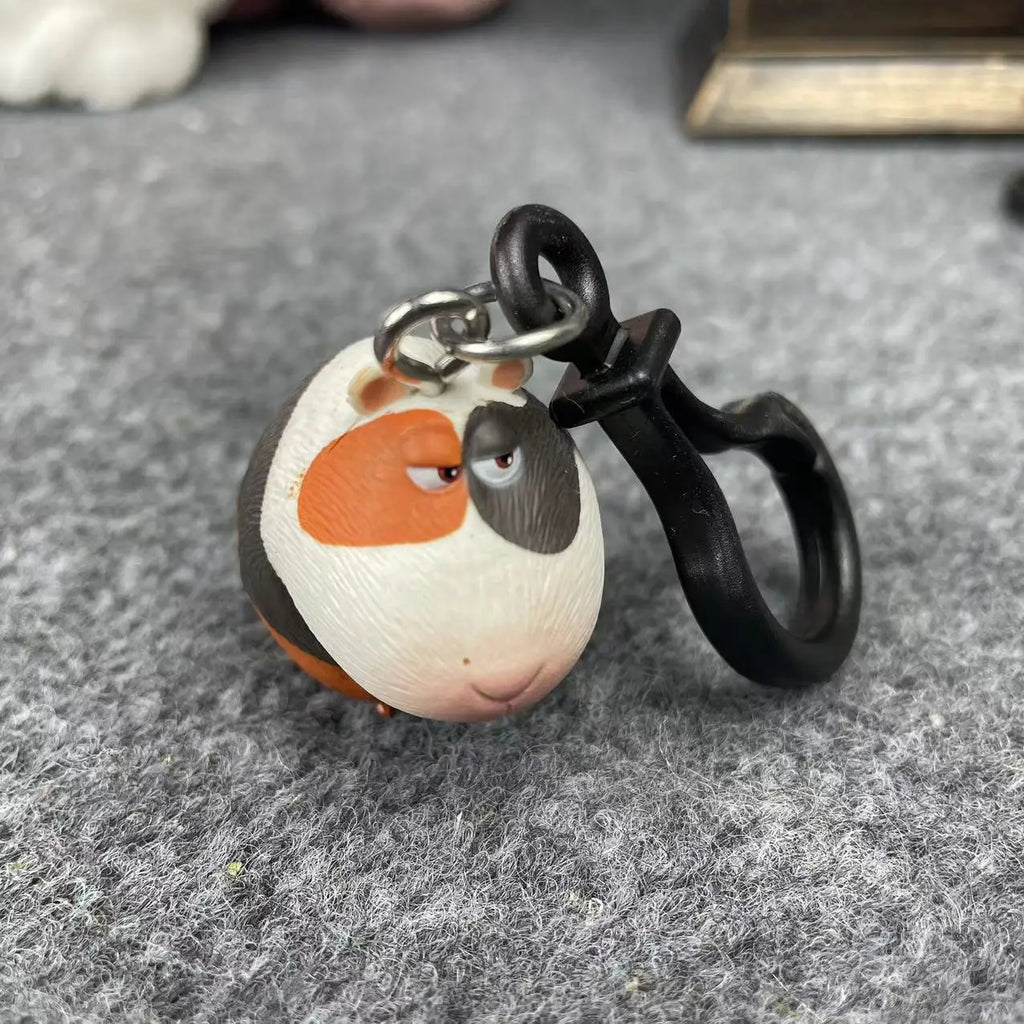 Cute Guinea Pig keychain from Secret Life of Pets, multicolor plastic figurine toy, perfect gift for pet lovers.
