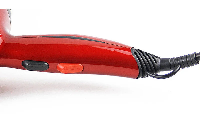 Red 2300W professional salon hair dryer with ergonomic handle, speed control switches, and 3m long power cord.