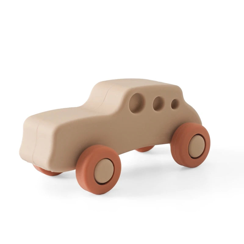 Beige and rust silicone car baby teething toy for soothing sore gums.
