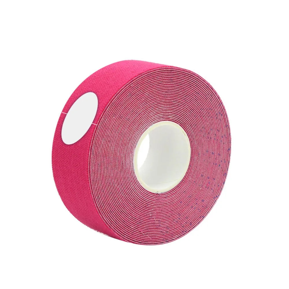 A roll of hot pink kinesiology face tape with a white plastic core, set against a plain white background.