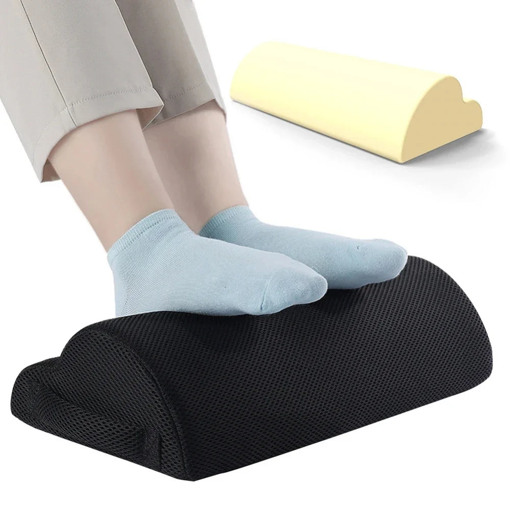 Ergonomic black memory foam under-desk foot rest with non-slip base for office fatigue relief.