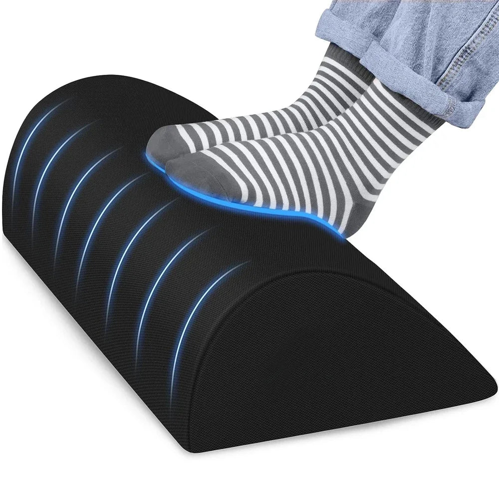 Black ergonomic memory foam under-desk foot rest stool for office support with non-slip base for fatigue relief.