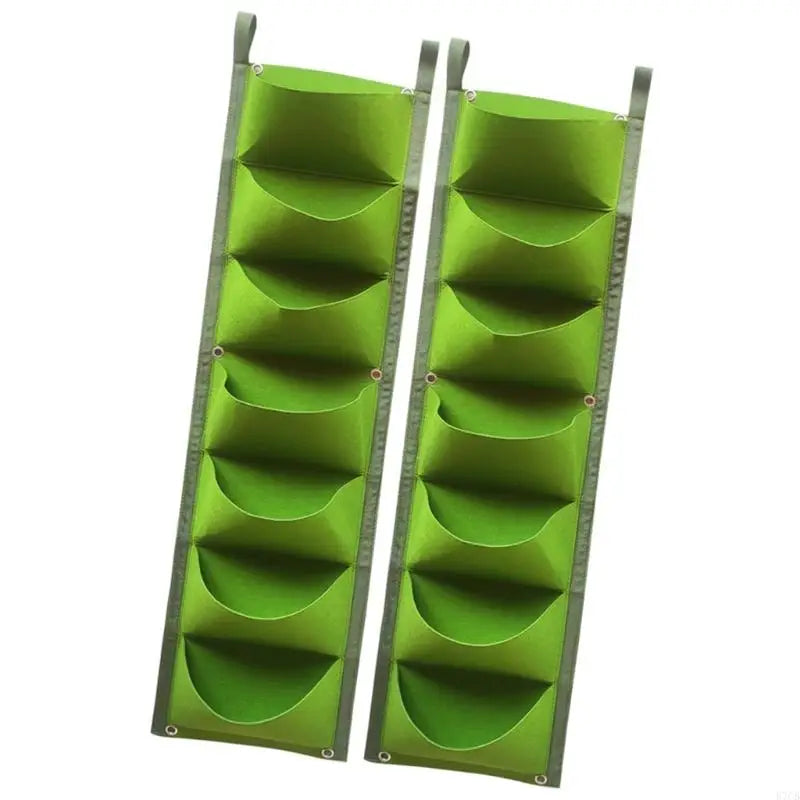 Two green vertical wall planter grow bags with 7 pockets each
