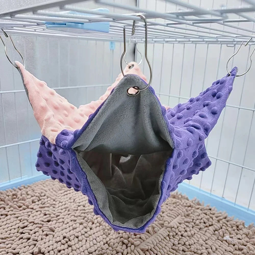 Cozy double-thick hanging hammock for small pets like guinea pigs. Purple and pink winter cage bed for extra warmth.