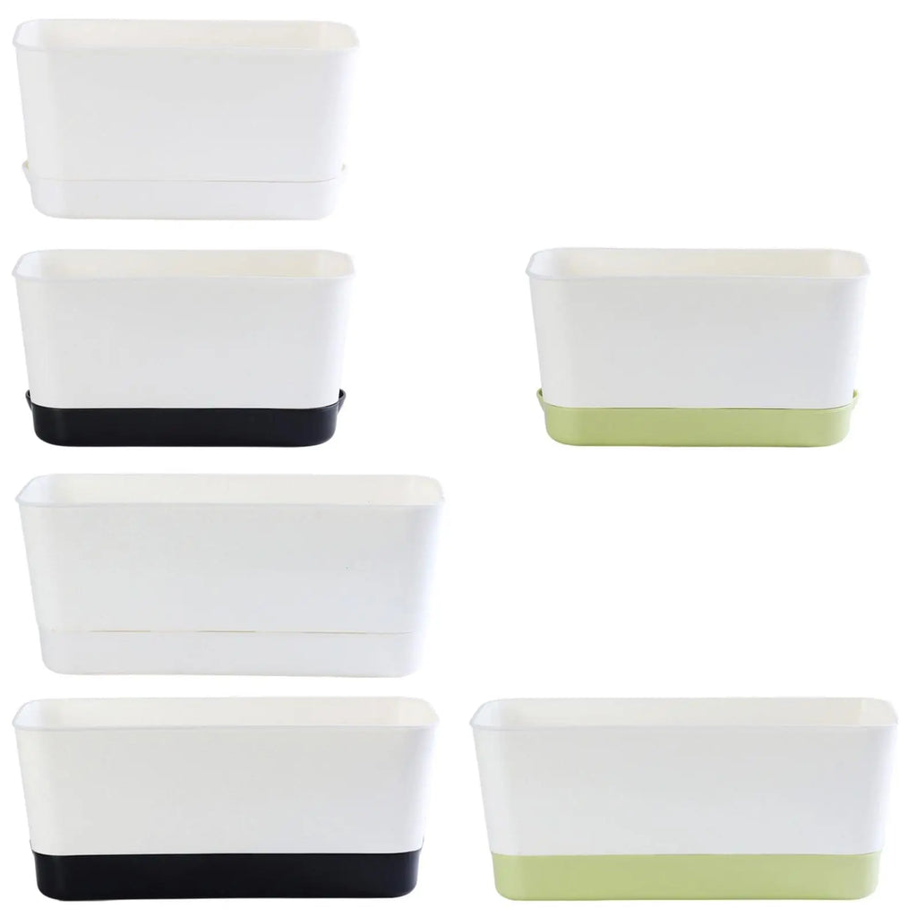 Rectangular window box planters in white with black base and white with green base.