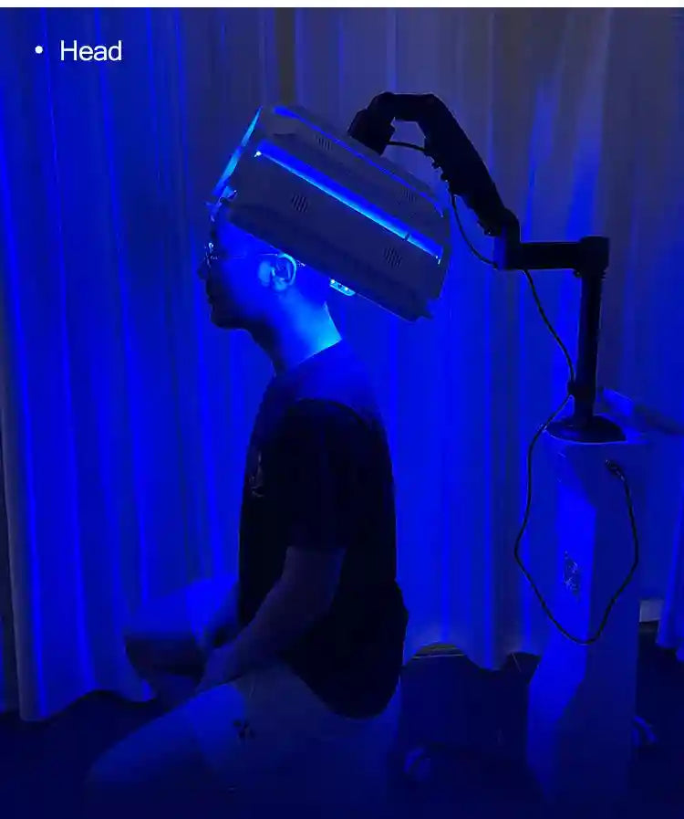 7-color LED therapy machine performing blue light head treatment with adjustable stand for professional skin care.