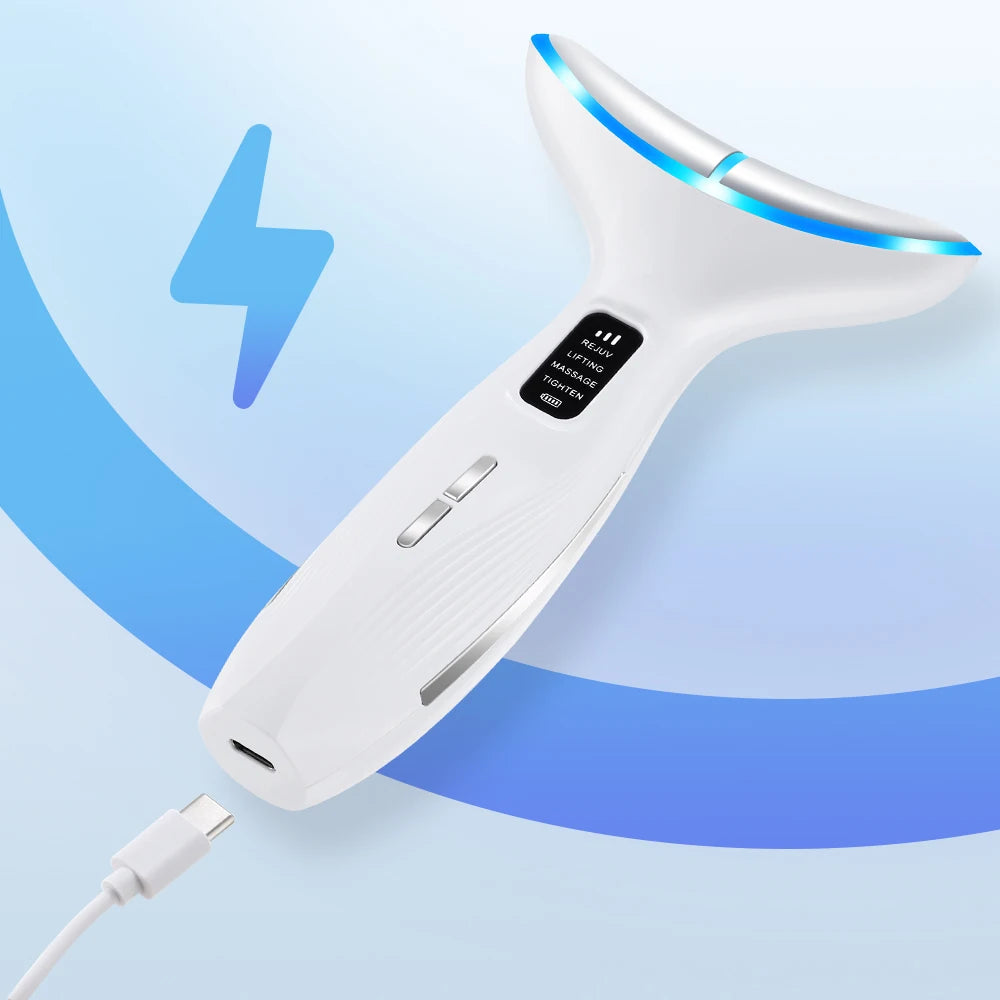 White ergonomic LED face and neck massager with a digital display and blue light, shown charging with a USB cable.