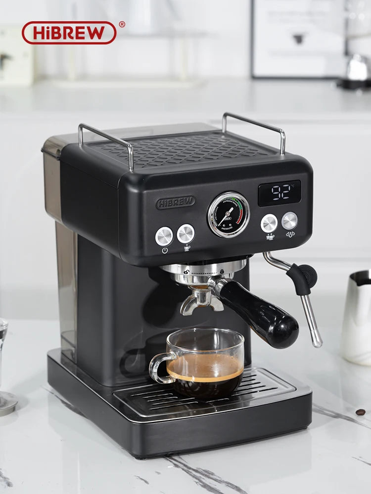 HiBREW black espresso machine with digital display, pressure gauge, steam wand, and portafilter on kitchen counter.